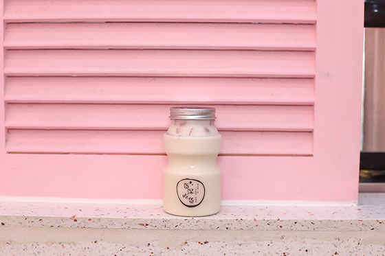 Moderne flessen melk thee verpakkingsoplossing voor 0,5 kg dranken