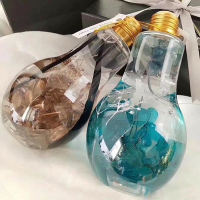 Hot Sale Juice Glass Jar Light Blub Shape met deksel 100ml Mini Size Lovely Light Bulb Shape PET Plastic Flask