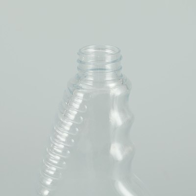 Glanzige ronde PET-plastic spuitfles met klassiek ontwerp doorzichtige kleur.