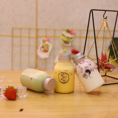 Plastic Milk Tea Bottles met Handvat en Schroefdop Drankverpakkingsoplossingen met Comfortabele Hantering
