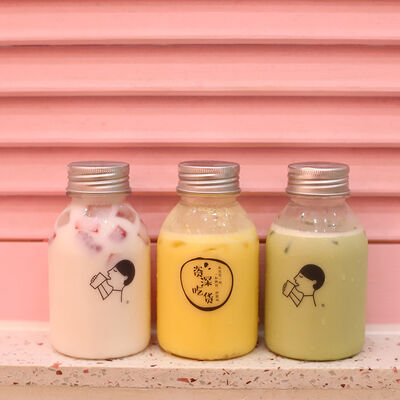 Plastic Milk Tea Bottles met Handvat en Schroefdop Drankverpakkingsoplossingen met Comfortabele Hantering