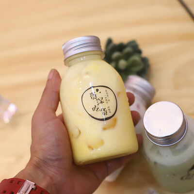 Plastic Milk Tea Bottles met Handvat en Schroefdop Drankverpakkingsoplossingen met Comfortabele Hantering