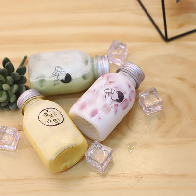 Plastic Milk Tea Bottles met Handvat en Schroefdop Drankverpakkingsoplossingen met Comfortabele Hantering